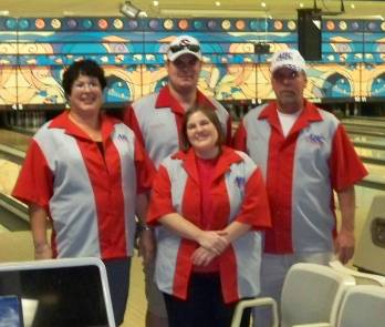 group of adults wearing bowling uniforms