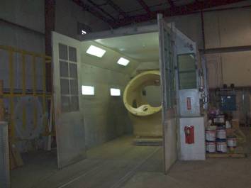 a photo of a large metal cylinder inside a compartment